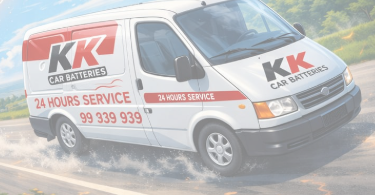 KK Car Batteries service van driving on a wet road